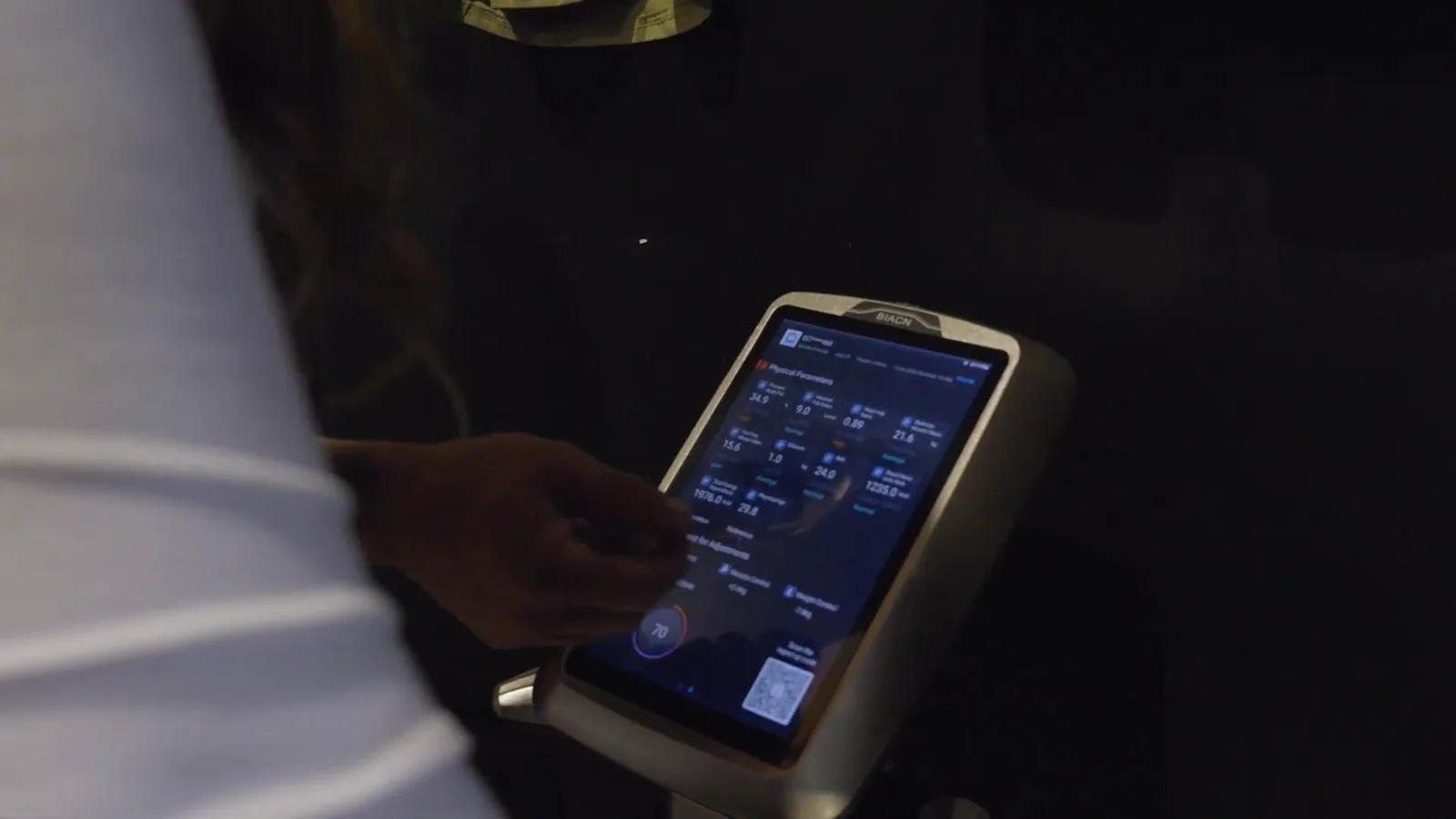 Member reviewing their body composition results on the scanner screen at Inception Gym Christchurch, showing body fat, muscle mass and other physical parameters