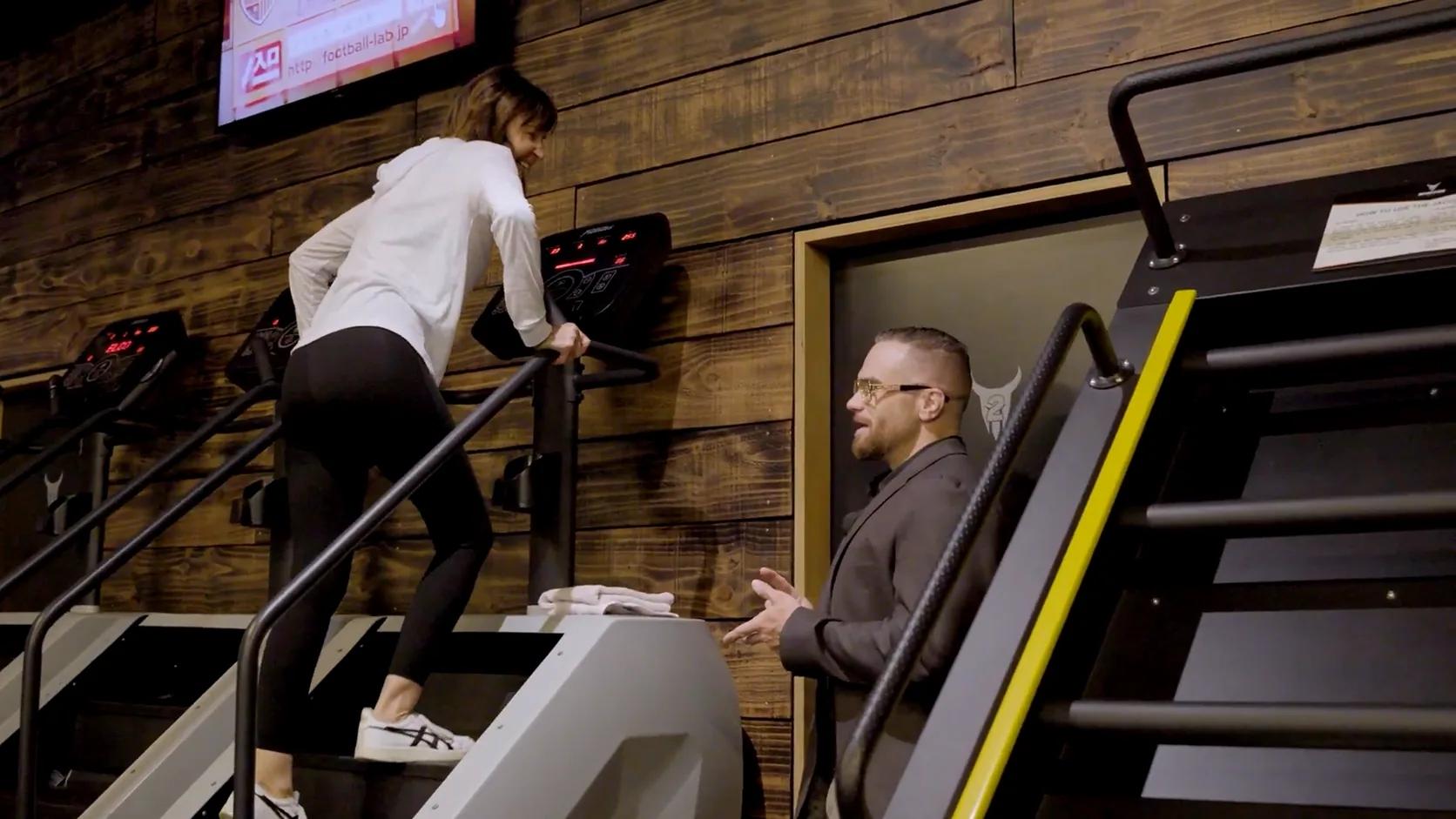 Inception Gym Christchurch co-founder Matt Walley talking with a member training on a stair climber, an owner-operated gym in practice